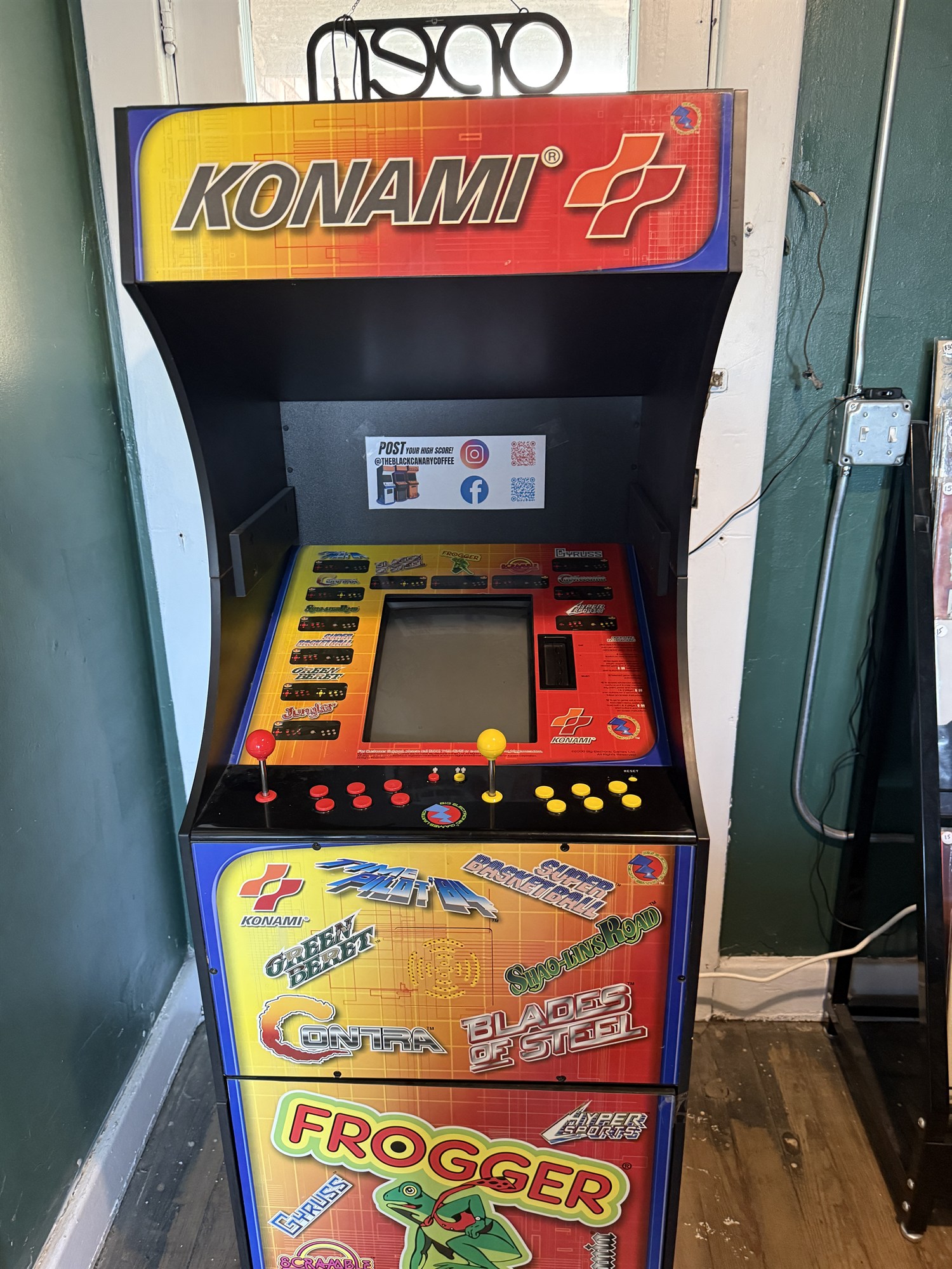 The colorful arcade cabinet in The Black Canary café